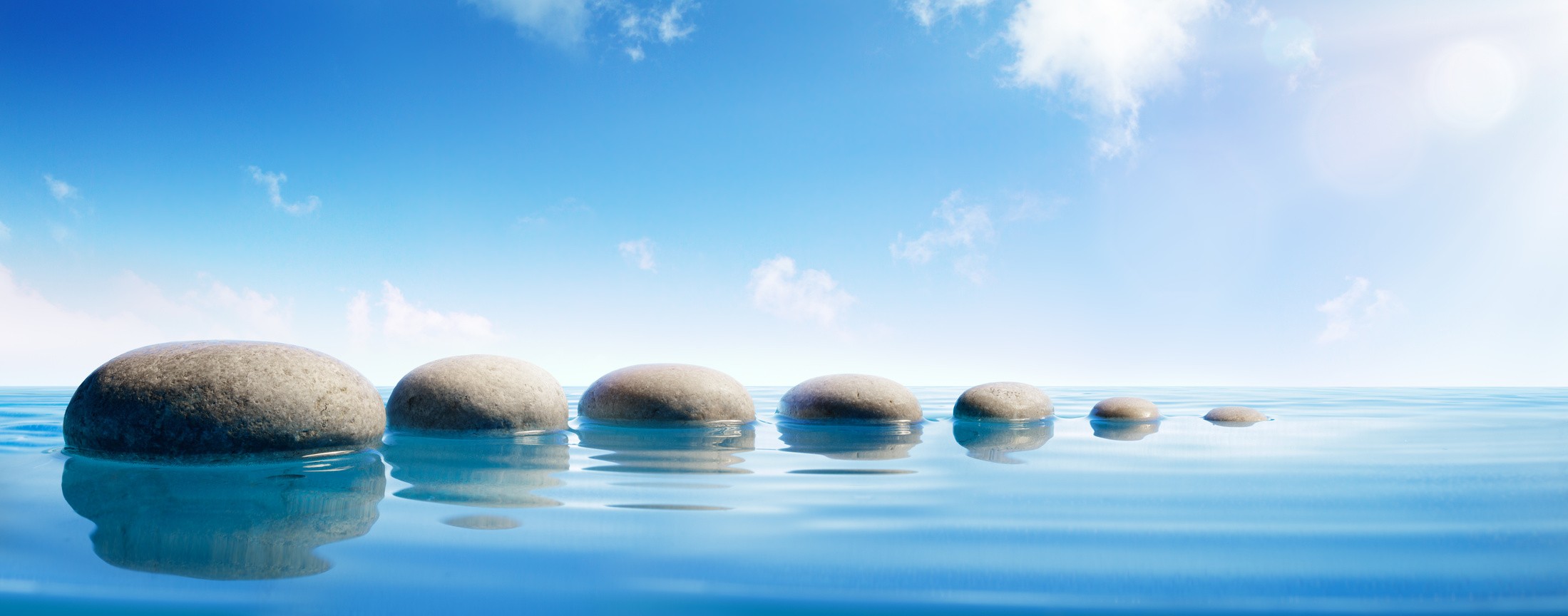 Step stones in blue water